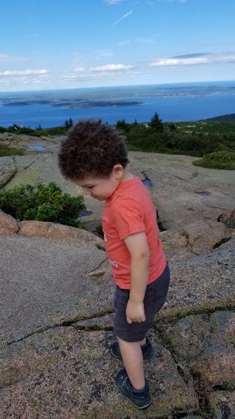 Small child on Maine mountaintop