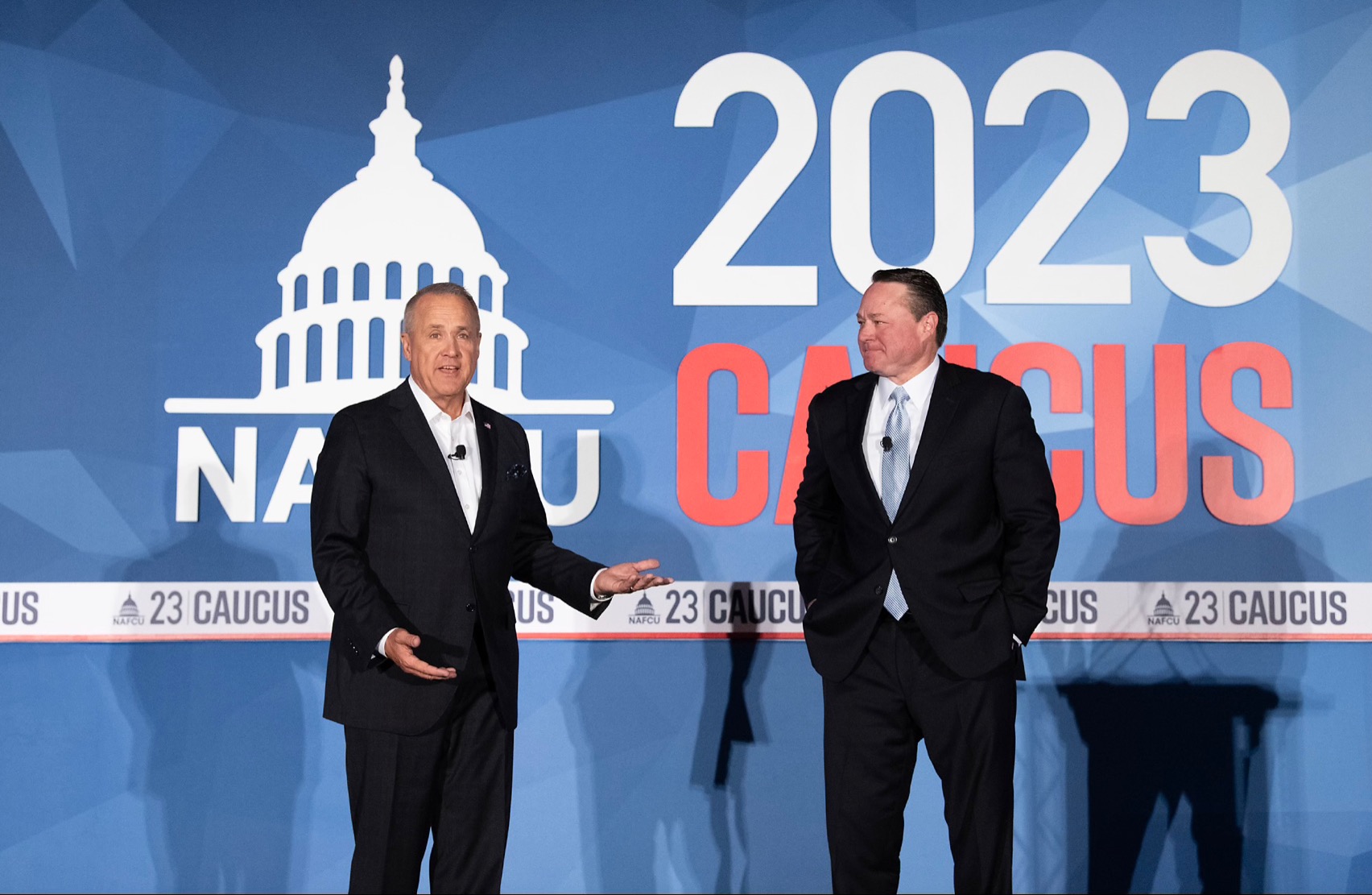 Jim Nussle (left) and Dan Berger share insights into the proposed transformation to America's Credit Unions at Congressional Caucus Monday. (Photo by Greg Dohler)