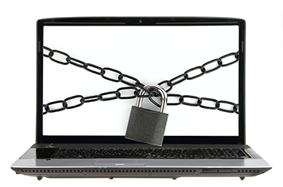 Computer bound with chain and padlock